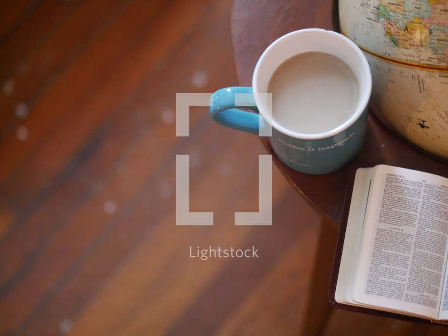 coffee mug, globe, and Bible 