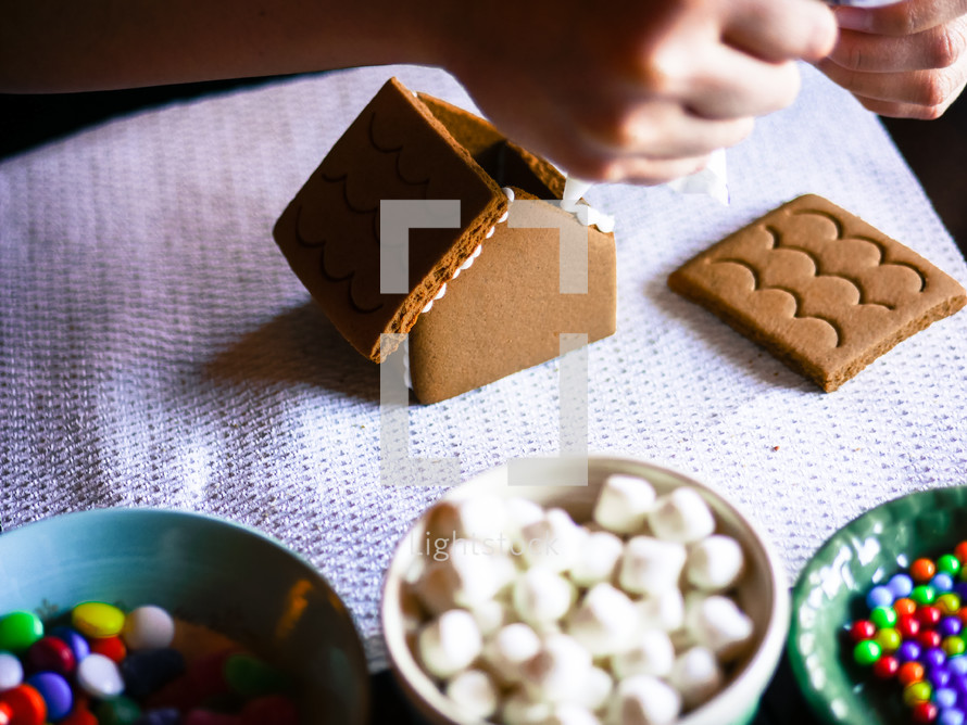 decorating gingerbread houses at Christmas 