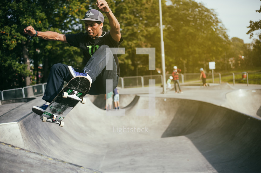 a man on a skateboard at a skatepark 