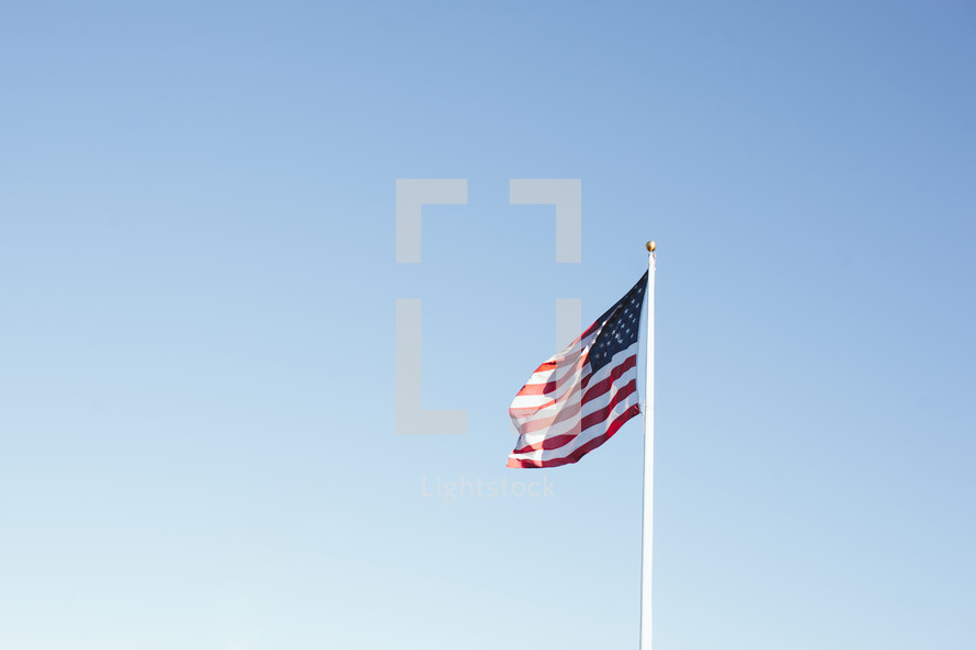 American flag flying on a pole.