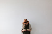 a woman standing reading a Bible 