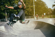 a man on a skateboard at a skatepark 