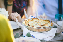 pie on an antler at a dinner table 