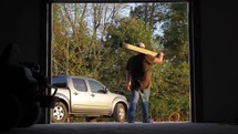 a man carrying lumber 