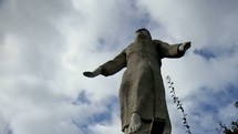 Timelapse of cloud movements over statue of Jesus in Honduras.