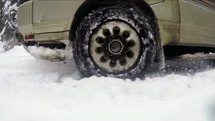 A car driving in snow. 
