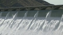 Water rushing through a dam.