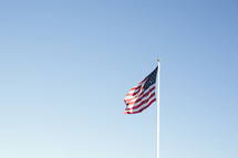 American flag flying on a pole.