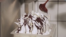 pouring chocolate on ice cream 