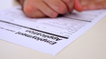 Man filling out application for employment