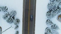 a car driving on a road in winter 
