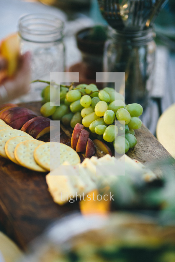 cheese and cracker plate and grapes 