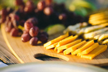 cracker and cheese plate with grapes 