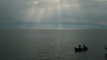 Compilation of shots from sunrise at the Sea of Galilee. Birds on a pier, boats, fishing. Shots from where Jesus taught.