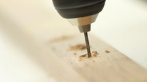 Drilling into wood.