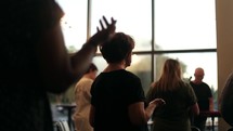 hands raised in worship and praise during a worship service 