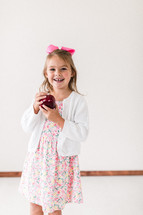 child holding an apple 