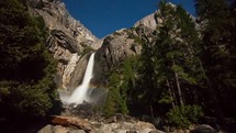 Timelapse of a moonbow on lower Yosemite Fall.  These lunar rainbows occur at night by the light of a full moon when the correct angle of the light strikes the mist from the falls.   The stars can be seen in the sky over the waterfall.  