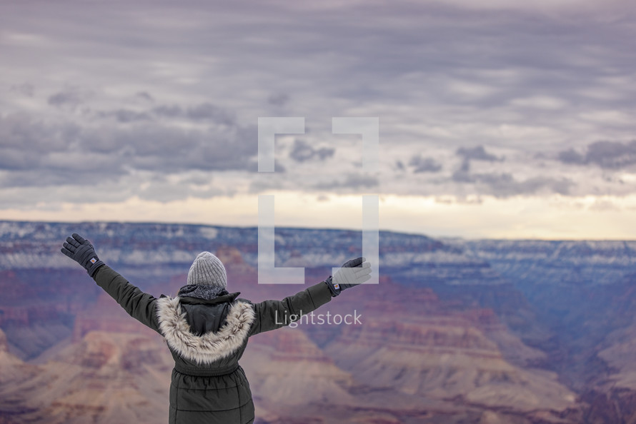Woman worshiping in the Grand Canyon
