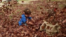 children playing in leaves 