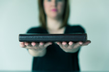 woman holding a Bible 