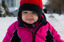 a toddler girl in a winter coat 