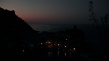 Time-lapse of a sunrise over a costal village. 