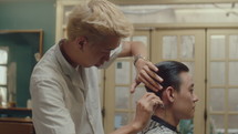 Young Asian Man Getting Haircut in Barbershop
