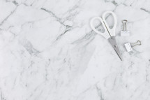 scissors and clips on marble 