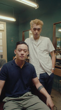 Asian Barber and Client Posing on Camera in the Barbershop