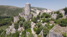 Medieval tower of ancient castel built in mountain, citadel balkan city Pocitelj
