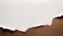 torn white textured paper atop brown kraft paper - a background to add your own color, text and art