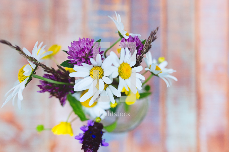flowers in a mason jar from above 