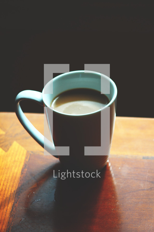 coffee mug on a wood table 