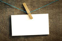 Card on a wire with clothes peg