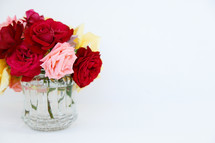 a vase full of roses 