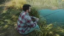 a man fishing in a lake 