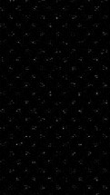 Flashing grey ASCII code lines on black background - Discrete and textured grayscale background animation for overlay on social media posts - Looped animation.
