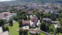 Aerial establishing shot of Serbian Orthodox Church of Holy Trinity, Circling shot, Banja Luka