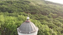 aerial view over a gazebo lookout on a mountainside 