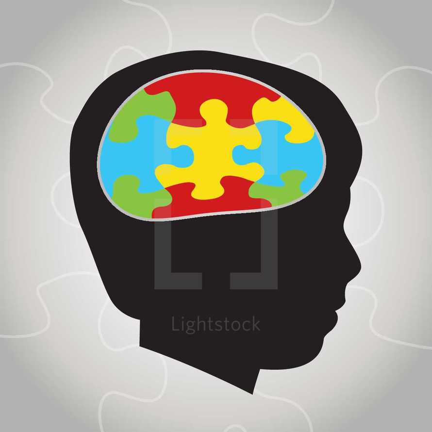 silhouette of a boy child with colorful puzzle brain - autism awareness 