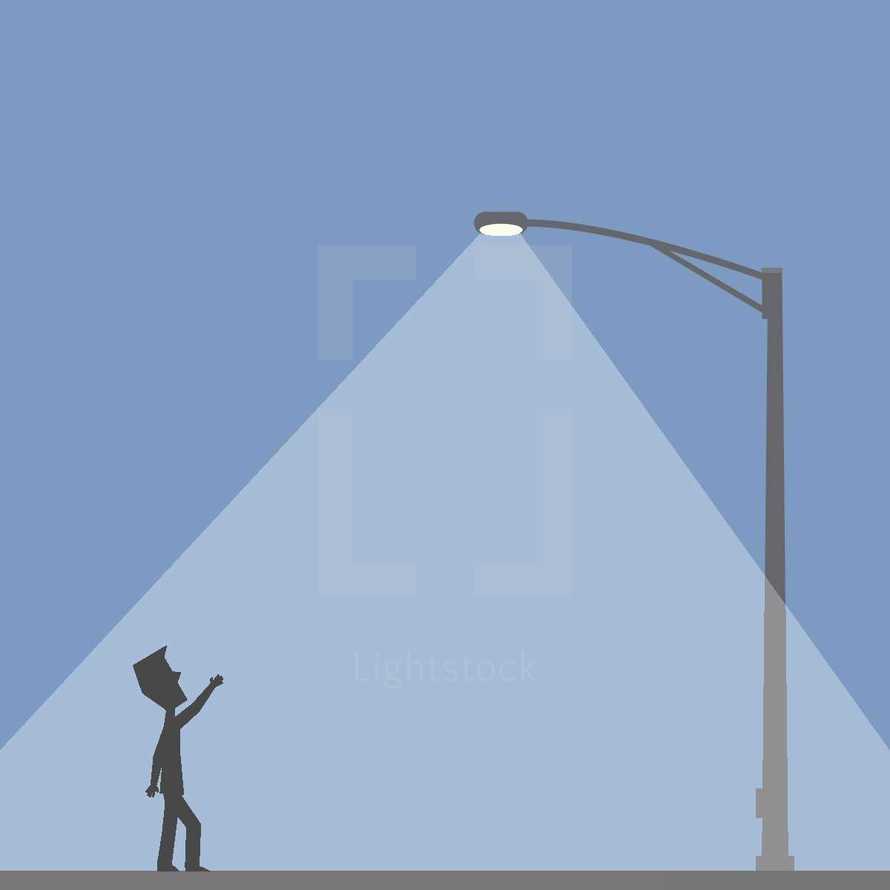man under a street lamp 