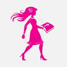 woman in pink walking carrying a Bible 