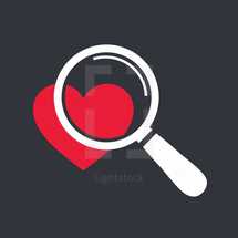 magnifying glass over a heart 