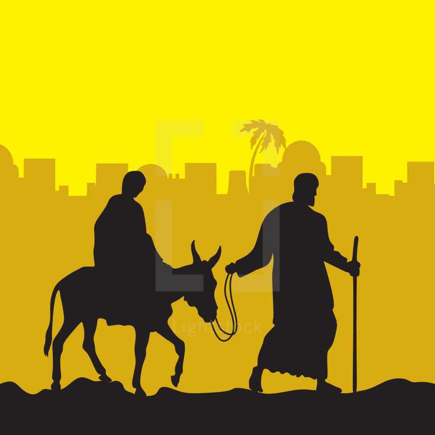 Mary on a donkey and Joseph 