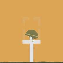Memorial day cross with helmet.
