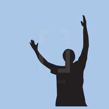 silhouette of a man with raised hands 