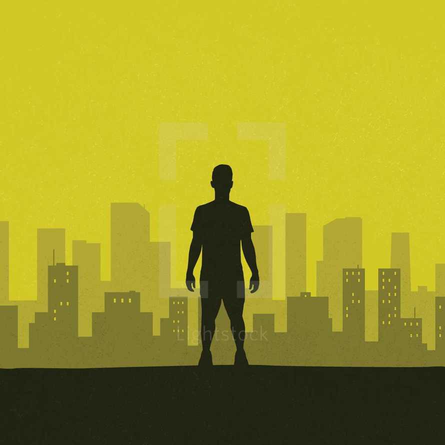 silhouette of a man standing in front of a city 