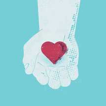 hand holding a heart.