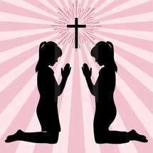 girls kneeling in prayer 